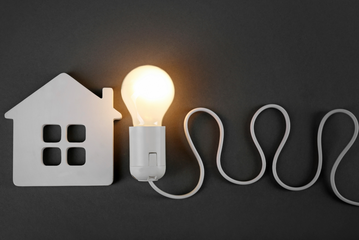 A photo of a home with a light beside it to portray 7 Home Electrical Safety Tips Everyone Should Know